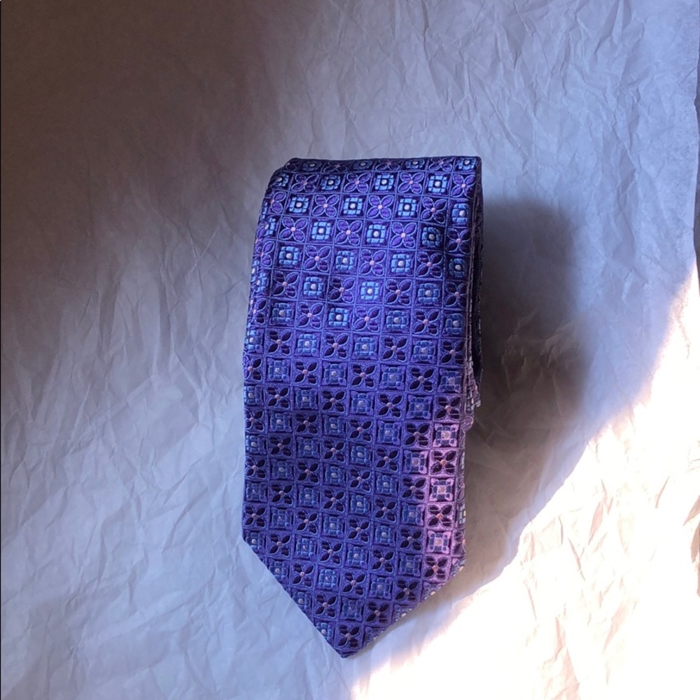 Purple neck tie with blue and purple square flower
